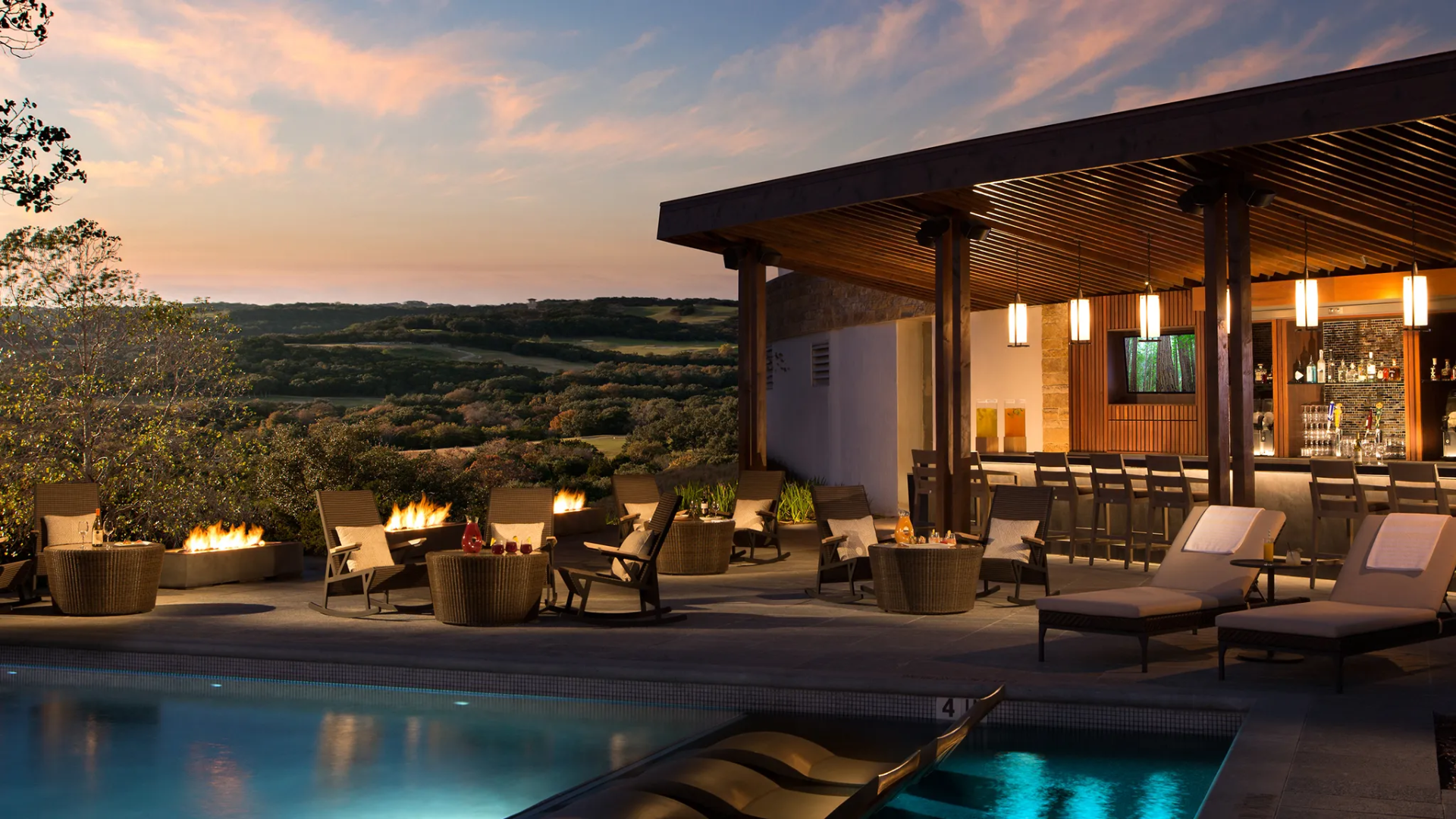 Poolside bar and lounge at sunset